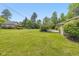 Expansive backyard featuring a lush lawn and beautiful landscaping around the perimeter of the home at 311 Thornberry Dr, Carmel, IN 46032