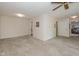 Open living room with carpet, ceiling fan, and access to other rooms at 311 Thornberry Dr, Carmel, IN 46032
