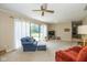 Bright living room featuring a sliding door, neutral walls, and carpet at 311 Thornberry Dr, Carmel, IN 46032