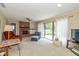 Cozy living room with brick fireplace, sliding door and backyard views at 311 Thornberry Dr, Carmel, IN 46032