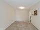 Living room featuring neutral walls, carpet, and access to other rooms at 311 Thornberry Dr, Carmel, IN 46032