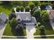 Aerial shot of a two-story house with a three-car garage and well-manicured lawn at 318 Meadowview Ln, Greenwood, IN 46142