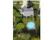 Overhead view of the house highlighting the large backyard pool and meticulously kept lawn at 318 Meadowview Ln, Greenwood, IN 46142