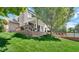 Backyard features a multi-level deck, mature trees, and in-ground pool at 318 Meadowview Ln, Greenwood, IN 46142