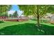 Manicured backyard features a deck with an above ground pool and a firepit area at 318 Meadowview Ln, Greenwood, IN 46142