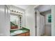 Bathroom featuring a sink, mirror, and view into the shower at 318 Meadowview Ln, Greenwood, IN 46142