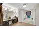 Bright bathroom features a soaking tub, a window for natural light, and vanity with a double sink at 318 Meadowview Ln, Greenwood, IN 46142