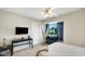 Bedroom featuring a mounted tv, a hammock chair and modern decor at 318 Meadowview Ln, Greenwood, IN 46142