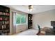 This cozy bedroom has a large window and built-in bookshelves for extra storage at 318 Meadowview Ln, Greenwood, IN 46142