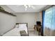 A comfortable bedroom with a desk, window, and ceiling fan at 318 Meadowview Ln, Greenwood, IN 46142