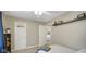 A bedroom showing a view into another room, ceiling fan, and wall decorations at 318 Meadowview Ln, Greenwood, IN 46142