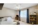 Cozy bedroom with neutral tones, window, and ceiling fan at 318 Meadowview Ln, Greenwood, IN 46142