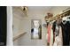 A bright walk in closet with clothing, shelves and a mirror at 318 Meadowview Ln, Greenwood, IN 46142