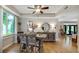 Dining area showcasing a large window and stylish decor with seamless flow to other rooms at 318 Meadowview Ln, Greenwood, IN 46142