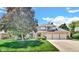 Charming two-story home with brick facade, manicured lawn, basketball hoop and a spacious three-car garage at 318 Meadowview Ln, Greenwood, IN 46142