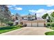 Charming two-story home with brick facade, manicured lawn, and a spacious three-car garage at 318 Meadowview Ln, Greenwood, IN 46142