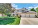 Charming two-story home featuring a three-car garage, brick accents, and well-manicured landscaping at 318 Meadowview Ln, Greenwood, IN 46142