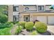 Close up of the charming home showcasing meticulous landscaping and a welcoming entrance at 318 Meadowview Ln, Greenwood, IN 46142