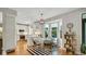 Eat-in kitchen area showcases white cabinets, and a comfortable seating area near bay windows at 318 Meadowview Ln, Greenwood, IN 46142