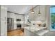 Modern kitchen featuring stainless steel appliances, white cabinets, and light countertops at 318 Meadowview Ln, Greenwood, IN 46142