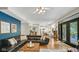 Open-concept living room with access to the kitchen and outdoor patio at 318 Meadowview Ln, Greenwood, IN 46142