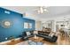 Spacious living room features a large black sectional sofa, and modern decor at 318 Meadowview Ln, Greenwood, IN 46142