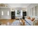 Bright and inviting living room with stylish furnishings, hardwood floors, and large windows at 318 Meadowview Ln, Greenwood, IN 46142