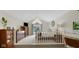 Bright main bedroom features vaulted ceilings and a large window to let in natural light at 318 Meadowview Ln, Greenwood, IN 46142