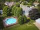 Aerial view of fenced backyard featuring a deck and round above ground pool at 318 Meadowview Ln, Greenwood, IN 46142