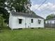 Exterior shot of home's rear, highlighting the backyard and landscaping at 330 S Butler Ave, Indianapolis, IN 46219