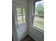 A well-lit entryway featuring a classic white door, large window, and natural light at 330 S Butler Ave, Indianapolis, IN 46219