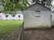 A view of a detached garage with a small yard at 330 S Butler Ave, Indianapolis, IN 46219