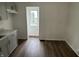 A charming kitchen featuring updated gray cabinets, a stainless steel sink, and modern countertops at 330 S Butler Ave, Indianapolis, IN 46219