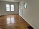 Spacious living room with beautiful hardwood floors and plenty of natural light at 330 S Butler Ave, Indianapolis, IN 46219