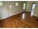 Bright living room featuring hardwood floors and a freshly painted interior at 330 S Butler Ave, Indianapolis, IN 46219