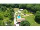 Expansive property with a pool, pond, large lawn and mature trees offering privacy and space at 3325 Kivett Ln, Martinsville, IN 46151