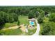 This large lot has a house with a pool, outbuildings, and is surrounded by mature trees at 3325 Kivett Ln, Martinsville, IN 46151