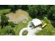 This expansive property includes a pond and outbuildings near the house and pool at 3325 Kivett Ln, Martinsville, IN 46151