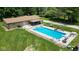 Backyard in-ground pool with slide, diving board, outdoor kitchen, and plenty of seating at 3325 Kivett Ln, Martinsville, IN 46151