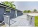 A freshly painted, gray back deck extends along the back of this home at 3414 Ferncliff Ave, Indianapolis, IN 46227