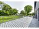 Backyard deck made of gray stained wood overlooking the green yard at 3414 Ferncliff Ave, Indianapolis, IN 46227