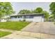 Home with brick facade and light blue front door at 3414 Ferncliff Ave, Indianapolis, IN 46227