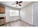 This kitchen features wood-look flooring, a window view, and stainless steel appliances at 3414 Ferncliff Ave, Indianapolis, IN 46227