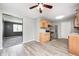 Eat-in kitchen featuring stainless steel appliances, wood cabinets, and an opening to the living room at 3414 Ferncliff Ave, Indianapolis, IN 46227