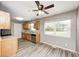 Kitchen featuring stainless steel dishwasher and a large window offering natural light at 3414 Ferncliff Ave, Indianapolis, IN 46227