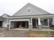New construction features a two-car garage and stone accents on the gray exterior at 3599 Hauser Ct, Bargersville, IN 46106