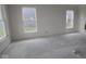 Spacious living room area with two windows showing the yard outside at 3599 Hauser Ct, Bargersville, IN 46106