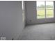 Bright bedroom with large windows overlooking a lush green space, awaiting finishes at 3611 Hauser Ct, Bargersville, IN 46106