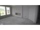 Spacious living room with large windows and a fireplace, ready for customization at 3611 Hauser Ct, Bargersville, IN 46106