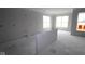 Unfinished living area bathed in natural light with large windows, ready for personalization at 3611 Hauser Ct, Bargersville, IN 46106